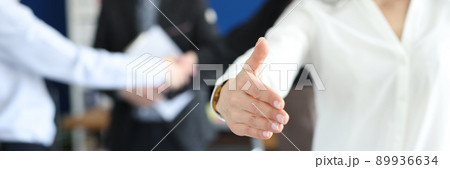 Smiling business woman stretches out her hand in the office 89936634