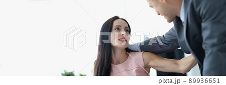 Man flirts with woman at workplace, harassment Man flirts with woman at workplace, harassment 89936651