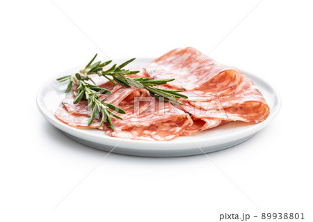 Sliced italian salami sausage with peppercorn isolated on white background. 89938801