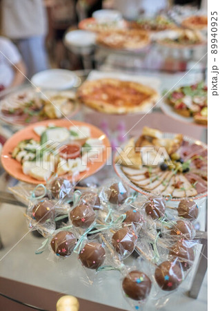 a lot of cold snacks on buffet table, catering. a lot of cold snacks on buffet table, catering. 89940925
