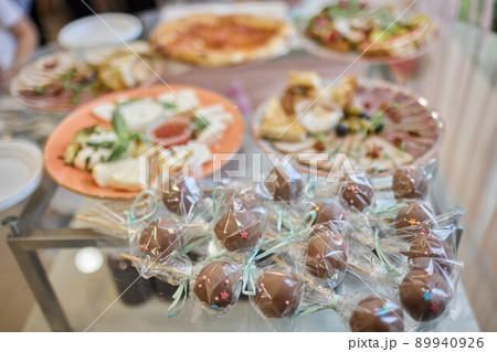 a lot of cold snacks on buffet table, catering. 89940926