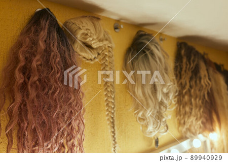 Wigs, natural and synthetic hair. Women's beauty concept. Close up photo of wig, hair for ladies. 89940929