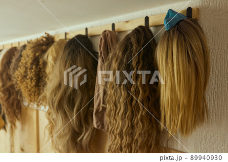 Wigs, natural and synthetic hair. Women's beauty concept. Close up photo of wig, hair for ladies. Wigs, natural and synthetic hair. Women's beauty concept. Close up photo of wig, hair for ladies. 89940930