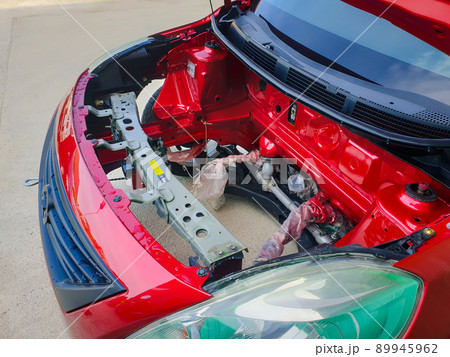 Checking car body work fiber bumper at car garage 89945962