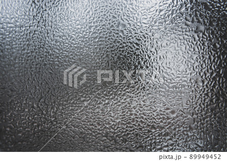 Abstract pattern of melt water on the window glass. 89949452