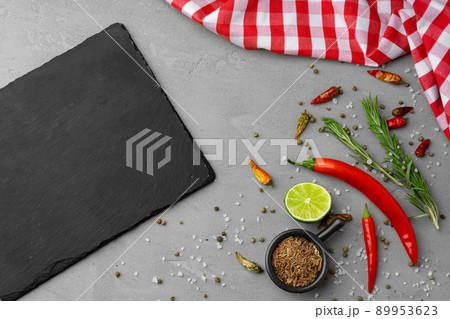 Various spices and herbs on gray background Various spices and herbs on gray background 89953623