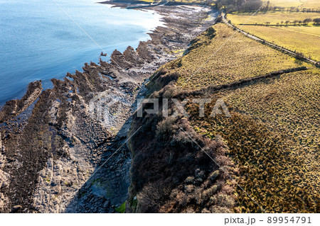 Aerial view of the amazing rocky coast at Ballyederland by St Johns Point in County Donegal - Ireland. Aerial view of the amazing rocky coast at Ballyederland by St Johns Point in County Donegal - Ireland. 89954791