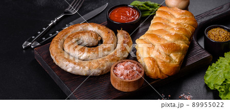 Baked homemade sausage with spices and herbs, close up 89955022