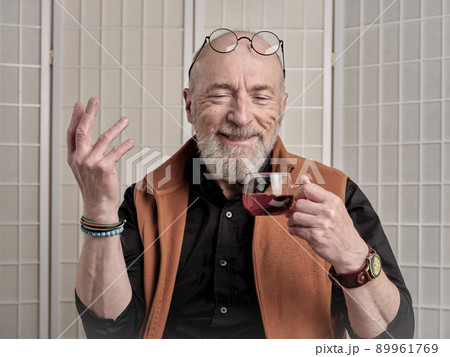 happy and smiling senior man drinking tea 89961769