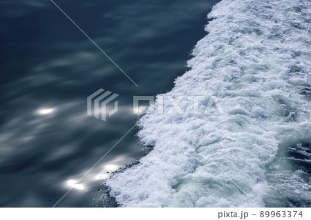 the waves from the ship on the background of the tranquil ocean the waves from the ship on the background of the tranquil ocean 89963374