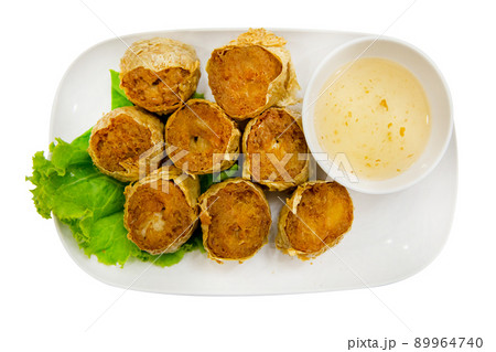Top view of Deep Fried Crab Meat Rolls with sweet sauce, focus selective Top view of Deep Fried Crab Meat Rolls with sweet sauce, focus selective 89964740