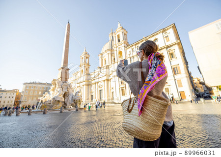 Woman walks on Piazza del Popolo in Rome city on a morning time 89966031