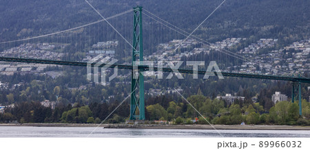 Lions Gate Bridge in a modern city on the West Coast of Pacific Ocean. Lions Gate Bridge in a modern city on the West Coast of Pacific Ocean. 89966032