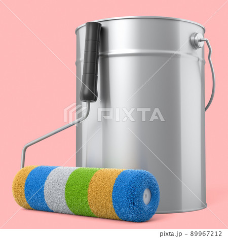 Open metal can with paint roller for painting walls on pink background. 89967212