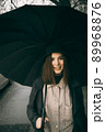 Emotional portrait, girl with umbrella, emotion - reaction to surprise, fright 89968876