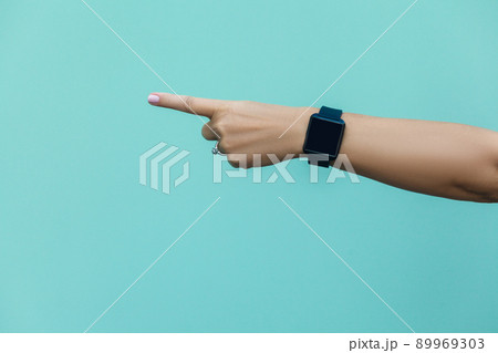 Look this! Hand finger pointing isolated on light blue background. Look this! Hand finger pointing isolated on light blue background. 89969303
