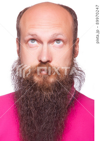 Portrait of the young bald thinking man with beard looks up. isolated on white. 89970247
