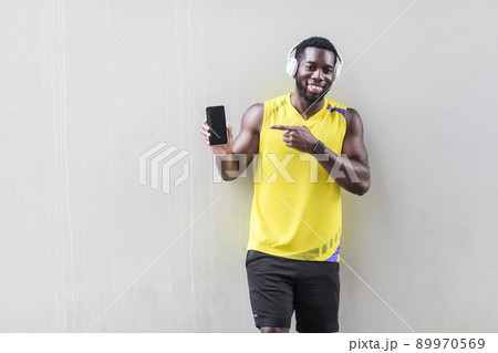 Copy spase for for sports nutrition or goods. Pointing finger at monitor phone. Outdoor shot, morning. Spring or summer Copy spase for for sports nutrition or goods. Pointing finger at monitor phone. Outdoor shot, morning. Spring or summer 89970569