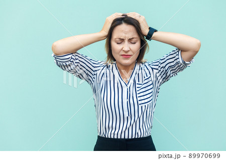 Bad emotions and feelings concept. Headache. Business woman touching head and have a migraine. Outdoor shot 89970699