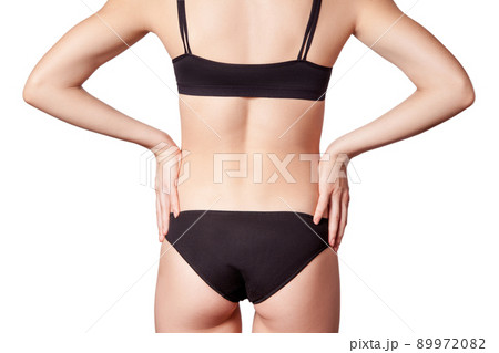 Closeup view of a young woman with pain in kidneys on white background. 89972082