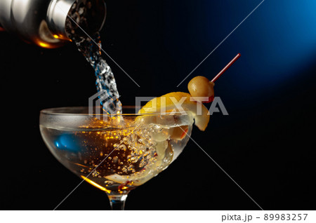 Martini with green olives and lemon. Martini with green olives and lemon. 89983257