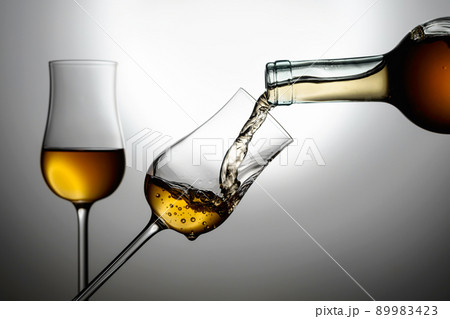 Glasses of premium alcohol. 89983423
