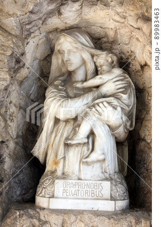 Madonna with Child, detail of a mourning sculpture on a Mirogoj cemetery in Zagreb, Croatia Madonna with Child, detail of a mourning sculpture on a Mirogoj cemetery in Zagreb, Croatia 89983463