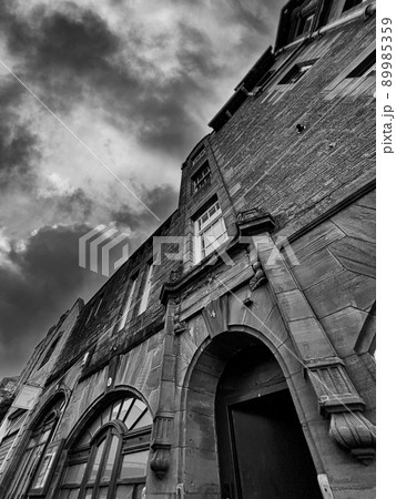 Shop Front And Red Sandstone Tenement Close Entrance - Black And White. Shop Front And Red Sandstone Tenement Close Entrance - Black And White. 89985359