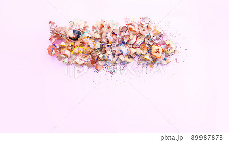 Wooden pencil shavings and colorful crumbs of graphite from sharpener. Top view. Wooden pencil shavings and colorful crumbs of graphite from sharpener. Top view. 89987873