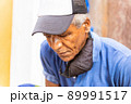 old afro american man sitting outdoors 89991517