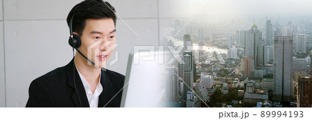 Business people wearing headset working in office in widen view Business people wearing headset working in office in widen view 89994193