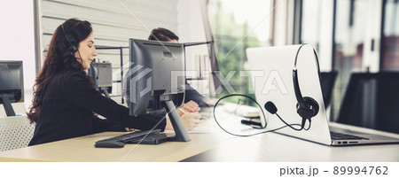 Business people wearing headset working in office broaden view 89994762