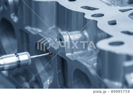 The multi-axis CMM machine measuring the cylinder head parts . The multi-axis CMM machine measuring the cylinder head parts . 89995759