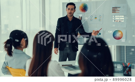 Business people in corporate staff meeting with envisional graphic 89996028