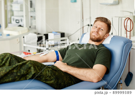 Smiling Military Man at Blood Donation Center Smiling Military Man at Blood Donation Center 89999389