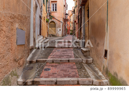 Menton. Old narrow street in the historic part of the city. Menton. Old narrow street in the historic part of the city. 89999965