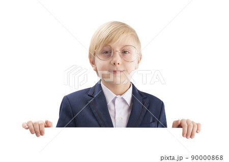 Serious boy with empty white paper board and laughs. Cute blond boy peeking out from behind white board. Space for text Serious boy with empty white paper board and laughs. Cute blond boy peeking out from behind white board. Space for text 90000868