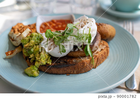 Healthy breakfast from poached eggs and veggies Healthy breakfast from poached eggs and veggies 90001782