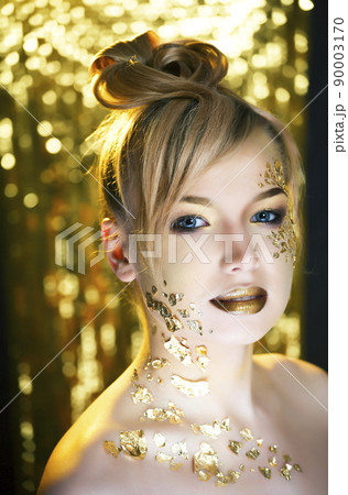 beauty blond woman with gold creative make up, luxury celebration close up beauty blond woman with gold creative make up, luxury celebration close up 90003170
