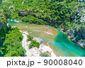 The purest waters of the turquoise color of the river Moraca flowing among the canyons. Montenegro. 90008040
