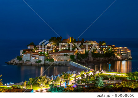 Romantic island of Sveti Stefan glow in the night with the moonlight. 90008050