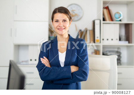 Portrait of successful business woman in office Portrait of successful business woman in office 90008127