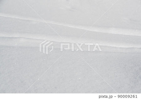 Ski trail in fluffy snow on winter day. Playing sports in nature. Parallel footprints from sled after snowfall. Ski trail in fluffy snow on winter day. Playing sports in nature. Parallel footprints from sled after snowfall. 90009261