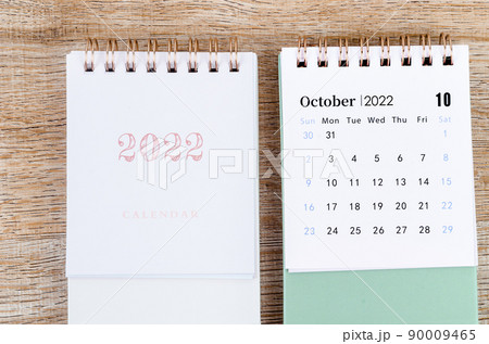 October 2022 desk calendar on wooden background. October 2022 desk calendar on wooden background. 90009465