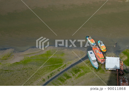 Many boats docked in the Chao Phraya River in the afternoon, Top view. Many boats docked in the Chao Phraya River in the afternoon, Top view. 90011868
