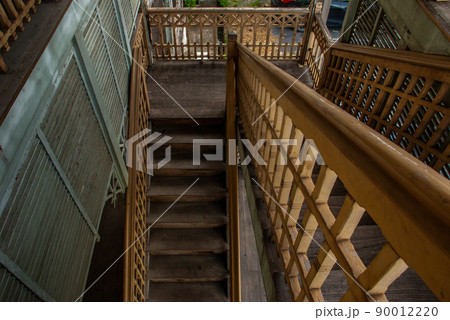 The stairs to the 2nd floor of old city hall, European style building. The vintage white wooden house was left to deteriorate over time, Once be Former city hall. 90012220