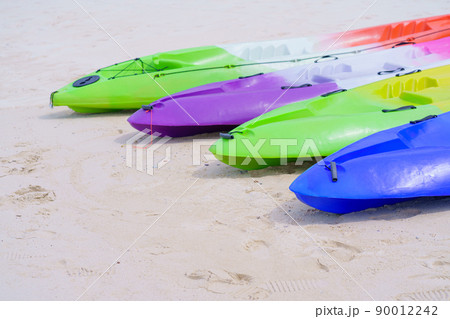 sea kayaks or multicolor boat on beautiful beach in Thailand sea kayaks or multicolor boat on beautiful beach in Thailand 90012242