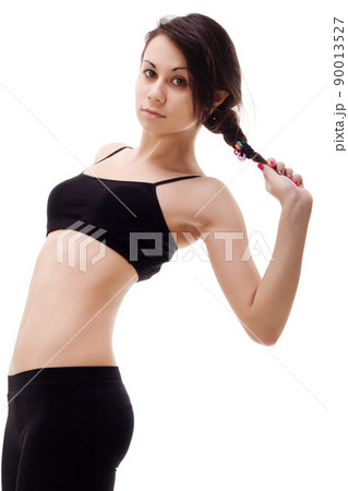 Young, fit and beautiful brunette woman in sportswear isolated on grey. Health care, diet, sport and fitness concept. Young, fit and beautiful brunette woman in sportswear isolated on grey. Health care, diet, sport and fitness concept. 90013527