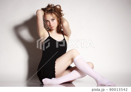 beautiful young girl in a short green dress and black stockings beautiful young girl in a short green dress and black stockings 90013542