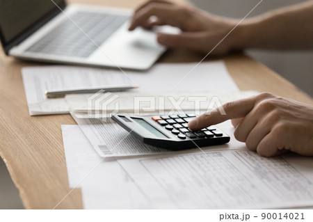 Young male accounting clerk filling in tax declaration electronic form Young male accounting clerk filling in tax declaration electronic form 90014021